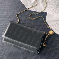 WOC Black sheep leather with golden ball